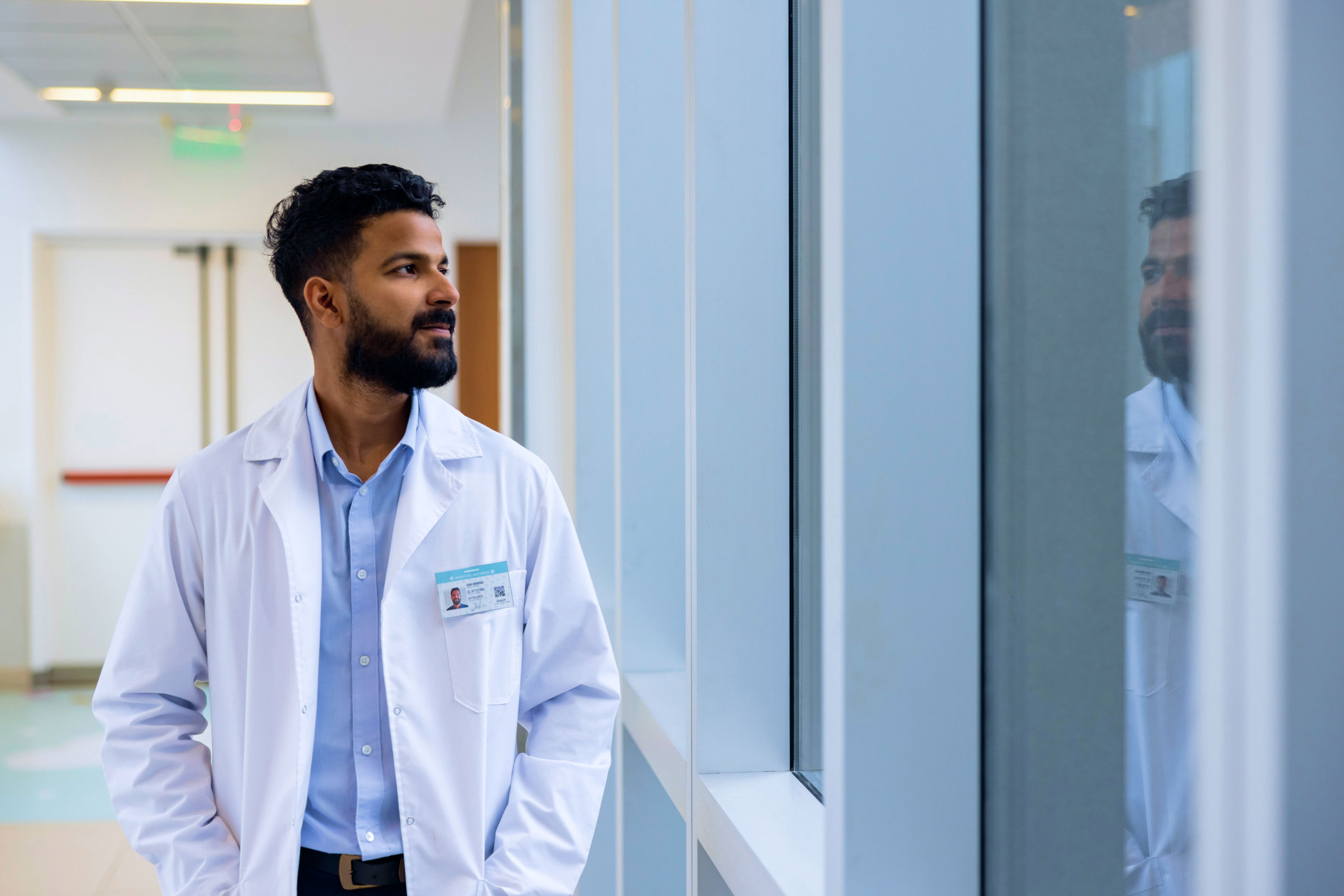 340B Pharmacist looking out hospital window